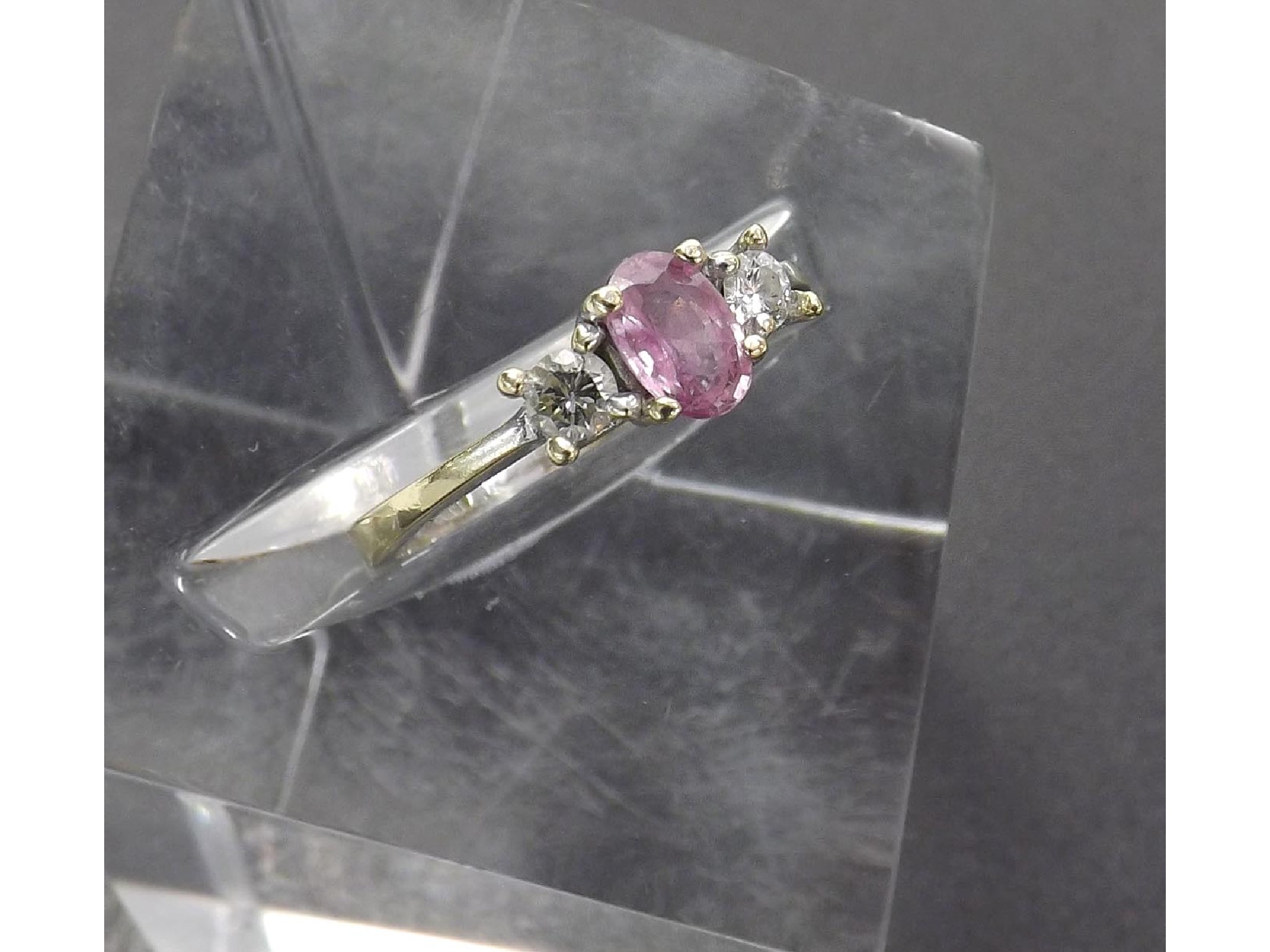 Appraisal: EYPJ W ct diamond and pink sapphire three stone ring