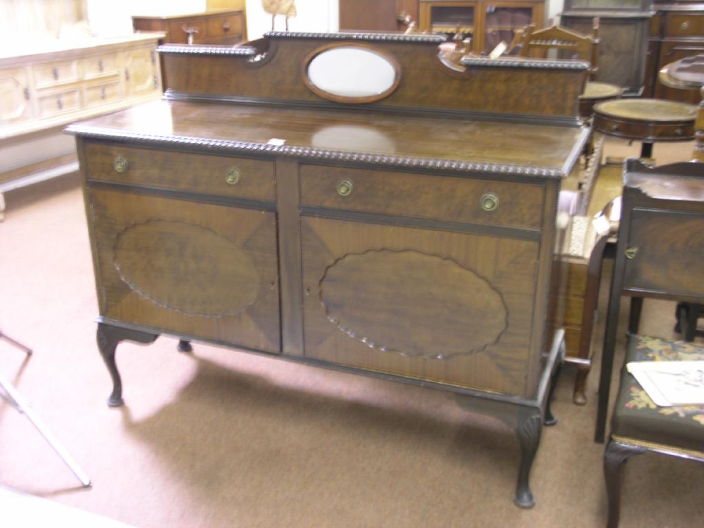 Appraisal: A George V mahogany sideboard gadrooned raised back above two