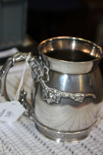 Appraisal: AN AMERICAN STERLING SILVER TANKARD of baluster form with relief