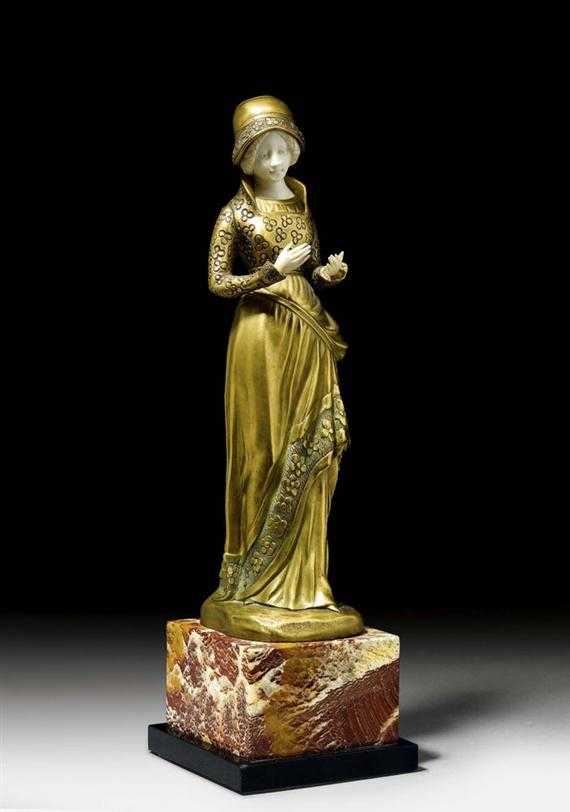 Appraisal: CANET BRONZE AND IVORY SCULPTURE circa Gilt bronze on marble