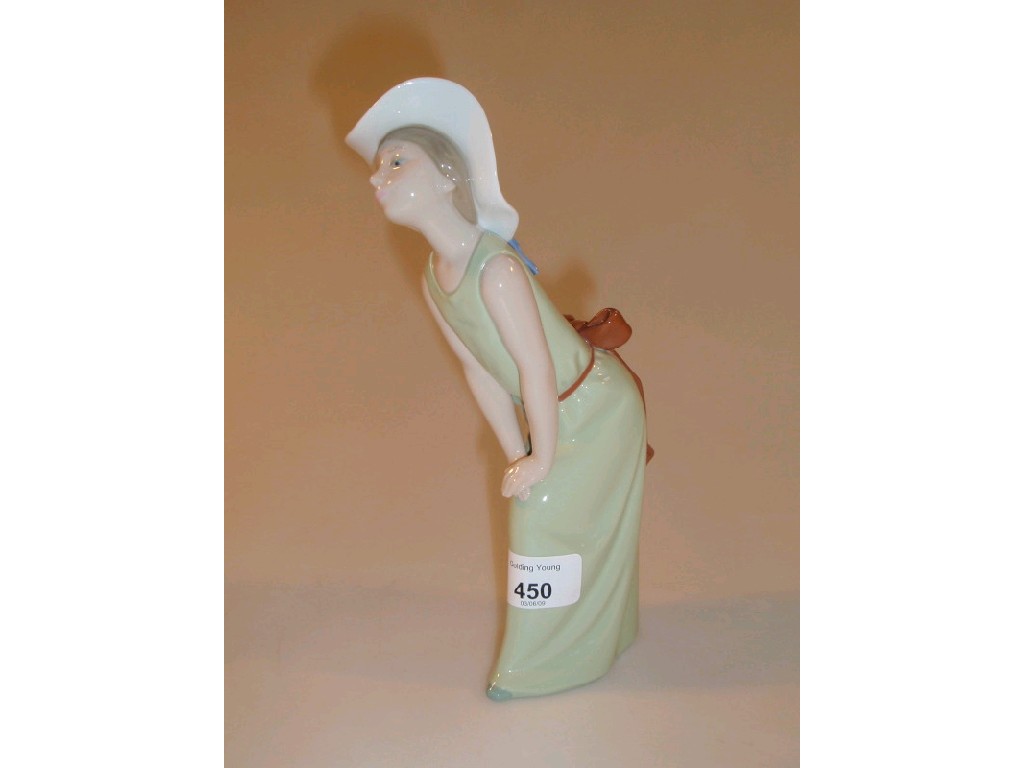 Appraisal: A Lladro figure of a young girl wearing a green