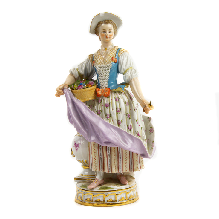 Appraisal: A MEISSEN FIGURE OF A LADY WITH BASKET OF FLOWERS