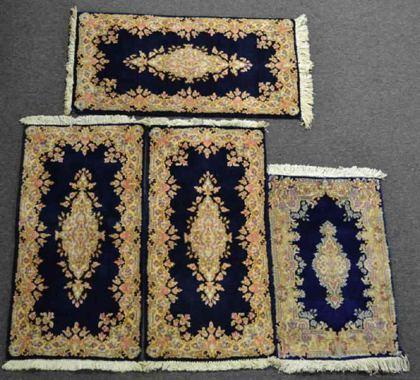 Appraisal: Small Kirman Area RugsAll navy with floral designs and additional