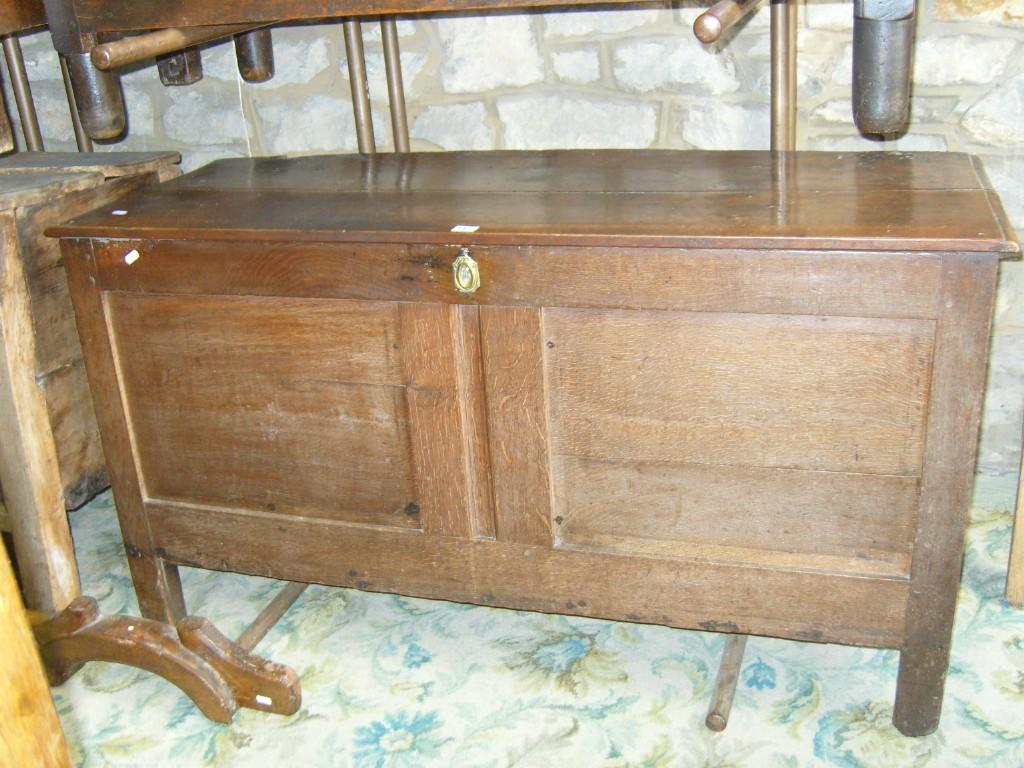 Appraisal: A Georgian oak coffer of plain form with panelled front