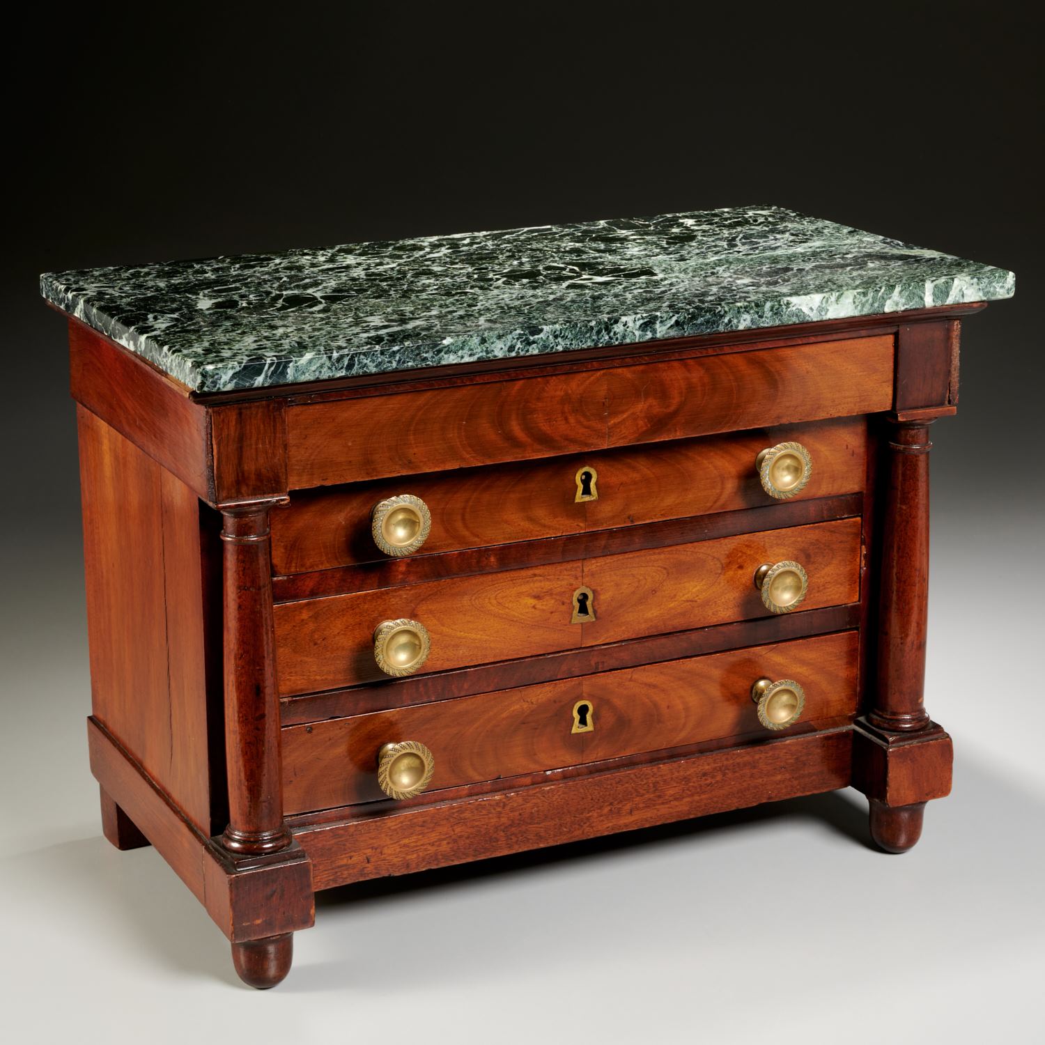 Appraisal: EMPIRE MAHOGANY MARBLE TOP MINIATURE COMMODE th c the green