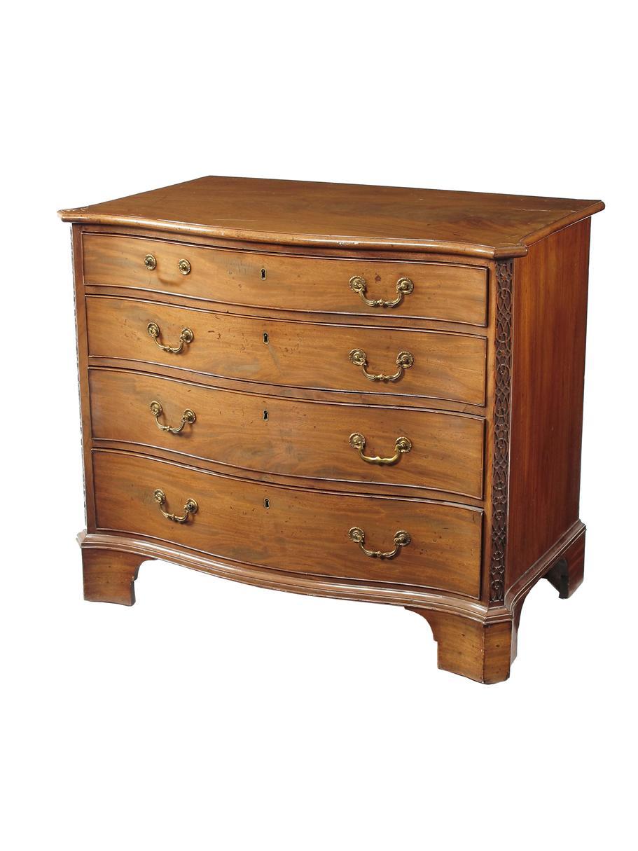 Appraisal: A George III mahogany serpentine commode