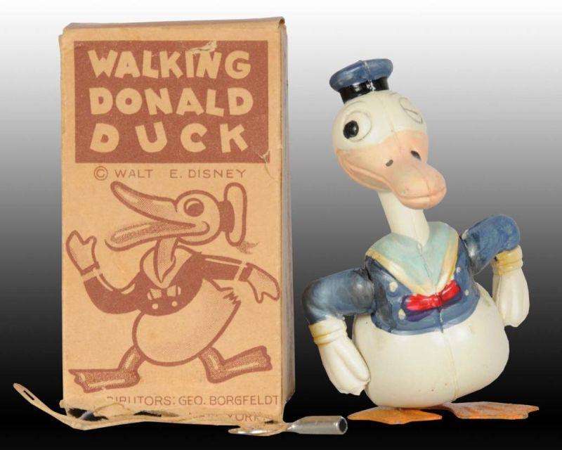 Appraisal: Japanese Tin Celluloid Walking Donald Duck Toy Description Includes original