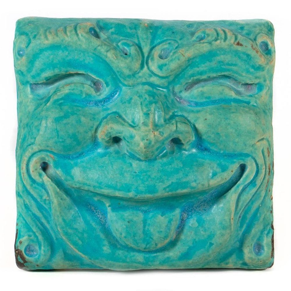 Appraisal: Pewabic Pottery Tile In the form of a grinning grotesque