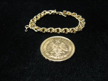 Appraisal: Single coin charm bracelet karat yellow gold heavy weight charm