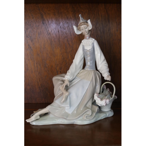 Appraisal: Lladro figure - lady with basket and shoes off approx