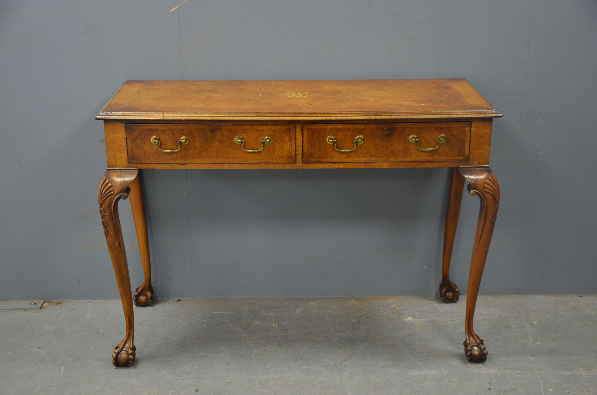 Appraisal: A burr walnut Georgian style side table with two frieze