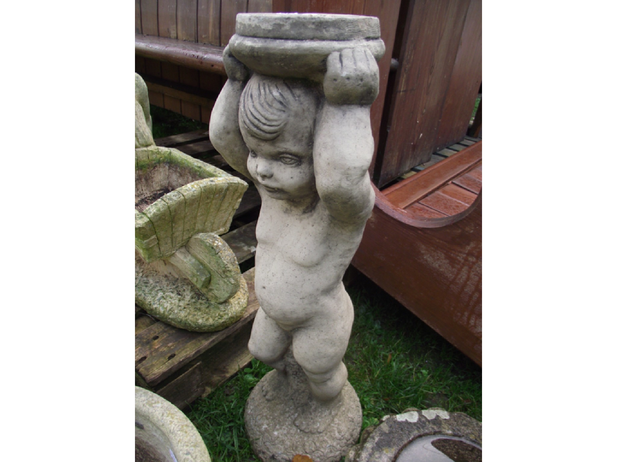 Appraisal: A contemporary cast composition stone two sectional bird bath in