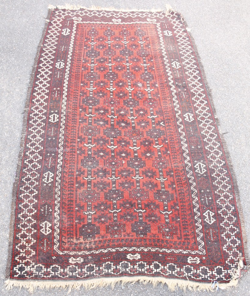 Appraisal: A Persian Belouch type rug with a design of medallions