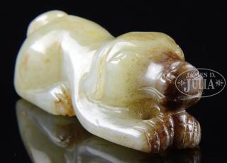 Appraisal: MOTTLED PALE GRAYISH CELADON JADE DOG China In recumbent pose