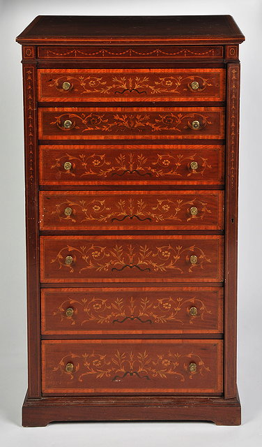 Appraisal: AN EDWARDIAN MAHOGANY AND SATINWOOD BANDED WELLINGTON CHEST by James