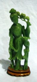 Appraisal: A Chinese figure of Kwanyin with phoenix carved green serpentine