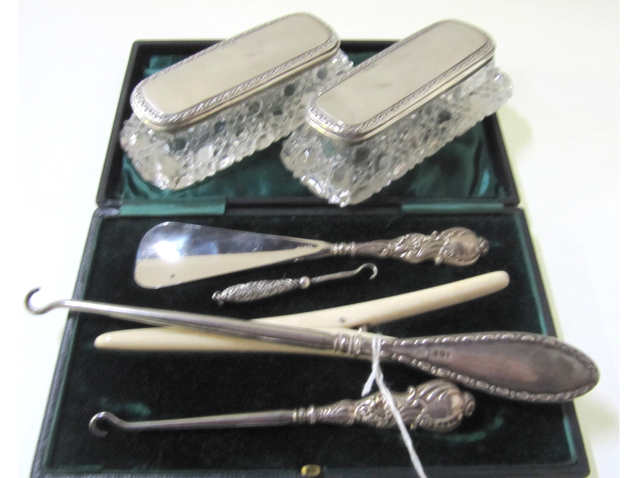 Appraisal: A lot comprising a pair of silver topped pin dishes