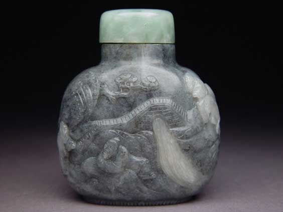 Appraisal: CARVED BLACK JADE SNUFF BOTTLE Finely hollowed carved Suzhou School-type