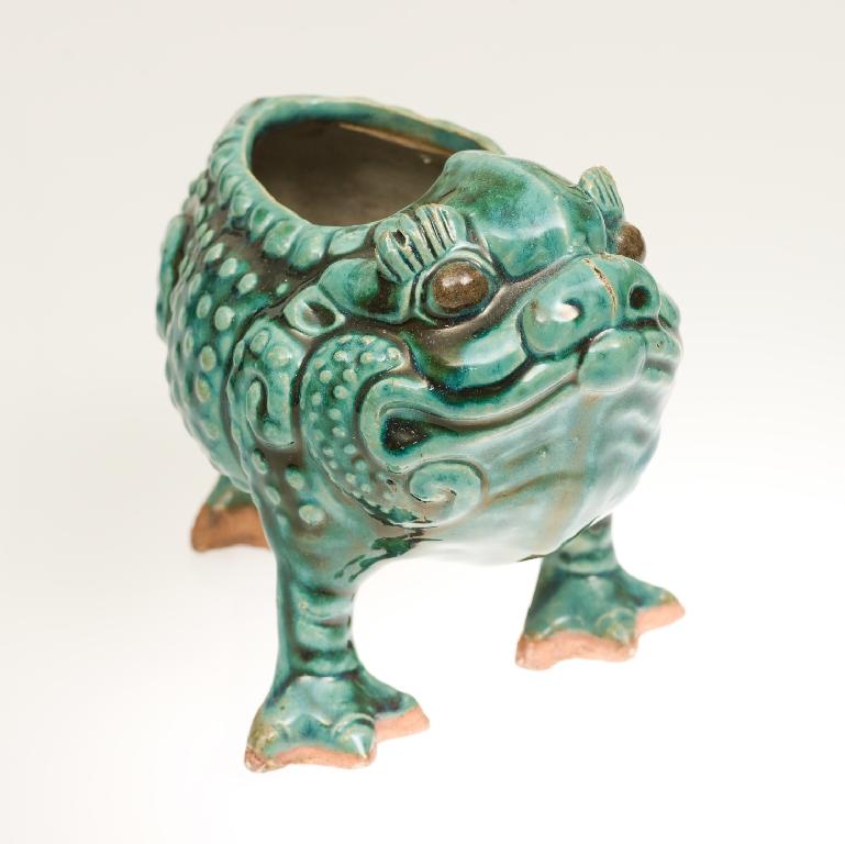 Appraisal: BURMANTOFTS GROTESQUE TOAD VASE c the green-glazed reptile moulded with