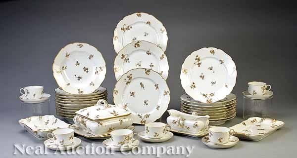 Appraisal: An Extensive Limoges Porcelain Dinner Service c decorated in an