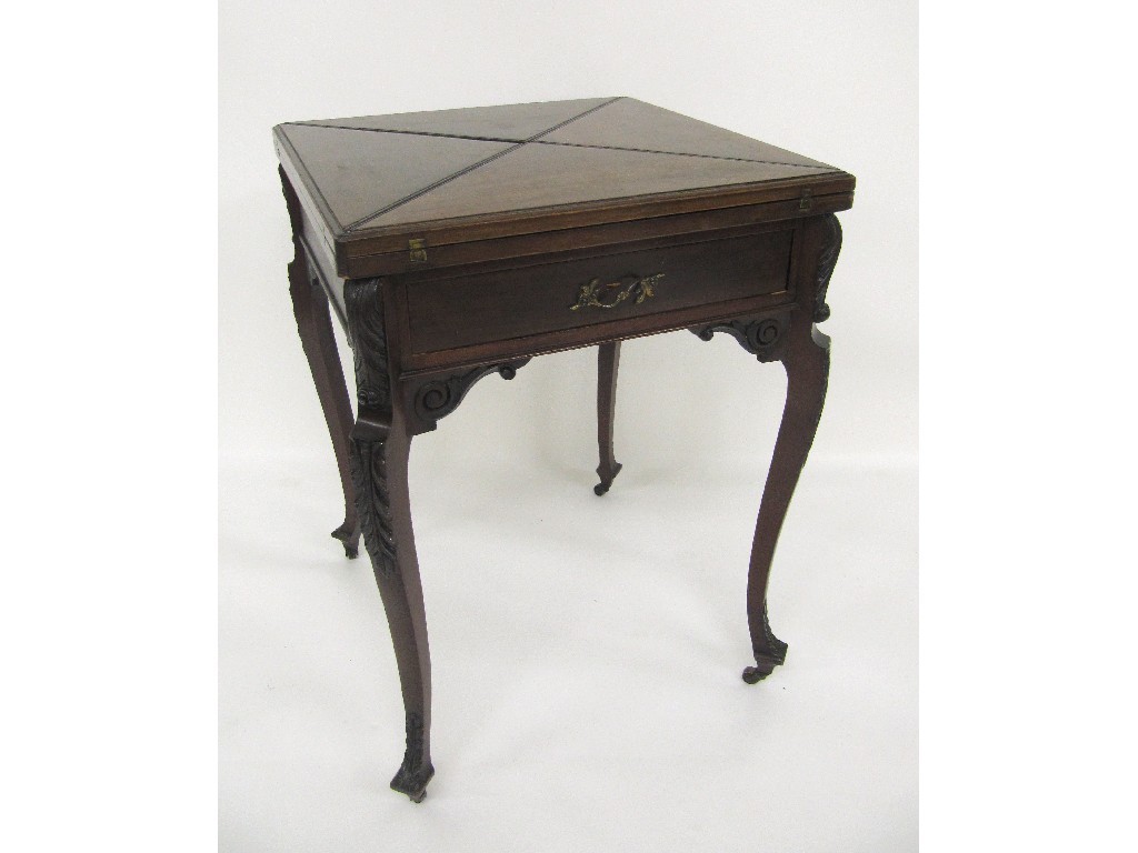 Appraisal: An Edwardian mahogany envelope card table raised on carved cabriole