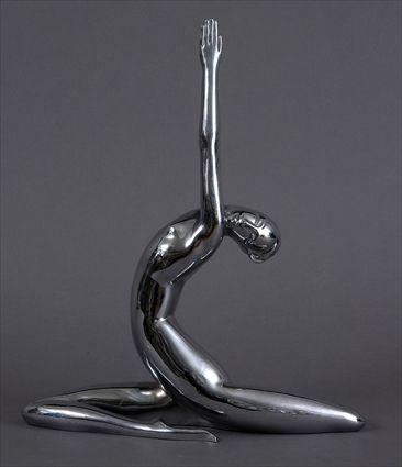 Appraisal: CHROME-PLATED FIGURE OF A FEMALE DANCER Modeled with back curved