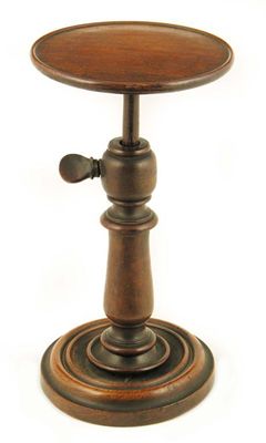 Appraisal: An early Victorian turned rosewood adjustable candle stand in cm