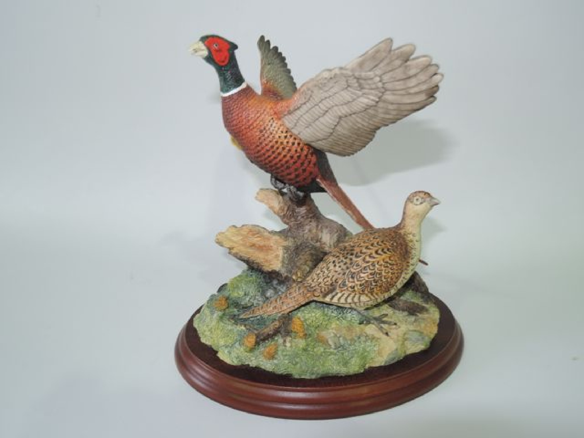 Appraisal: A Border Fine Arts group of a pair of pheasants