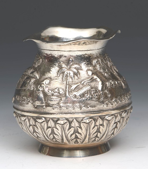 Appraisal: AN INDIAN WHITE METAL VASE of baluster form with embossed