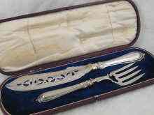 Appraisal: A cased pair of Victorian silver fish servers by J