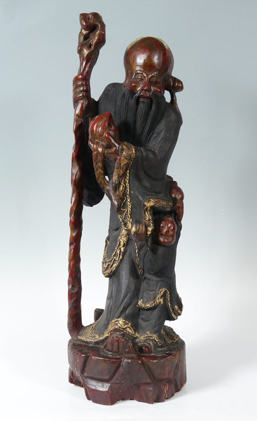 Appraisal: CARVED WOOD BUDDHA CHINESE FIGURE Red and black paint decoration