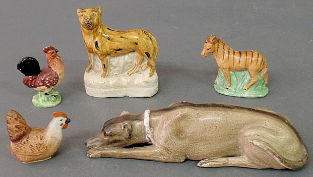 Appraisal: Five small Staffordshire animals th c largest dog h