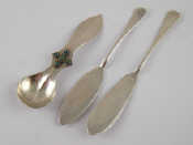 Appraisal: Two modern silver butter knives together with a white metal