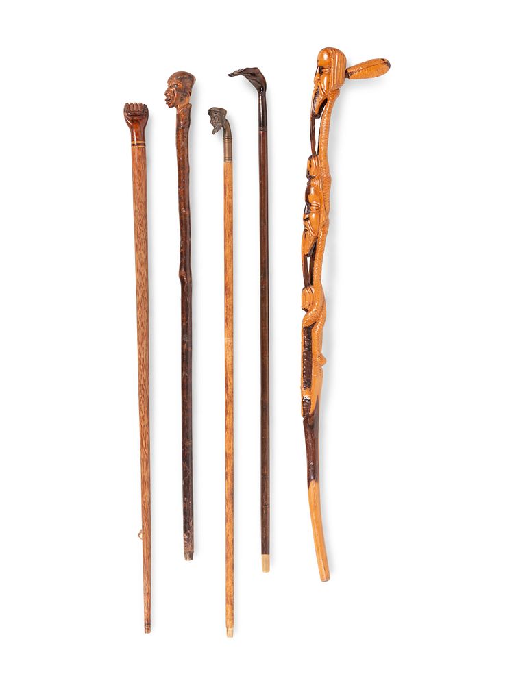 Appraisal: Five Carved and Mixed Metal Figural Canes and Walking Sticks