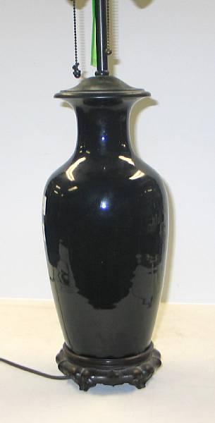 Appraisal: A mirror black glazed porcelain baluster vase th Century Drilled