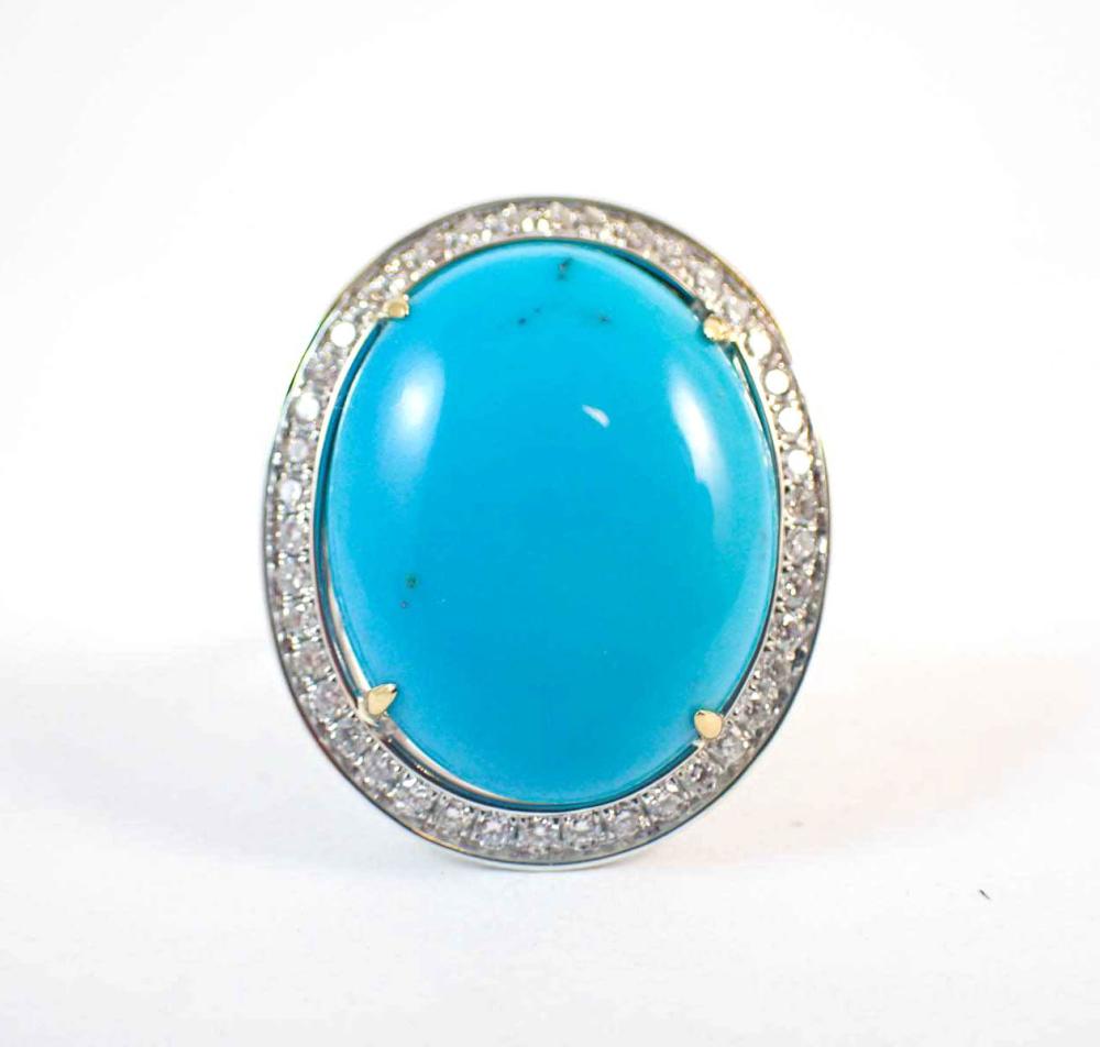 Appraisal: TURQUOISE DIAMOND AND FOURTEEN KARAT WHITE GOLD RING featuring a