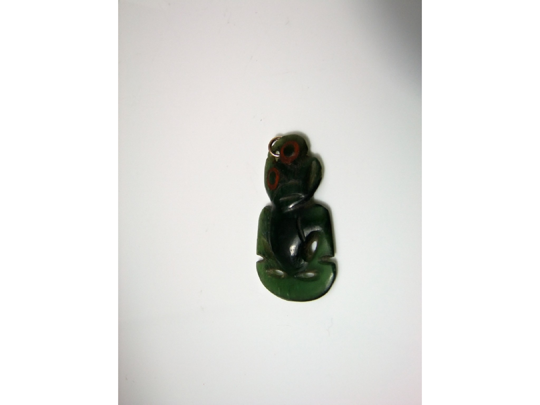 Appraisal: A Maori nephrite hei-tiki pendant cm long approx