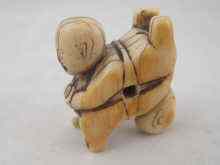 Appraisal: A th c Chinese erotic ivory toggle carved as twin