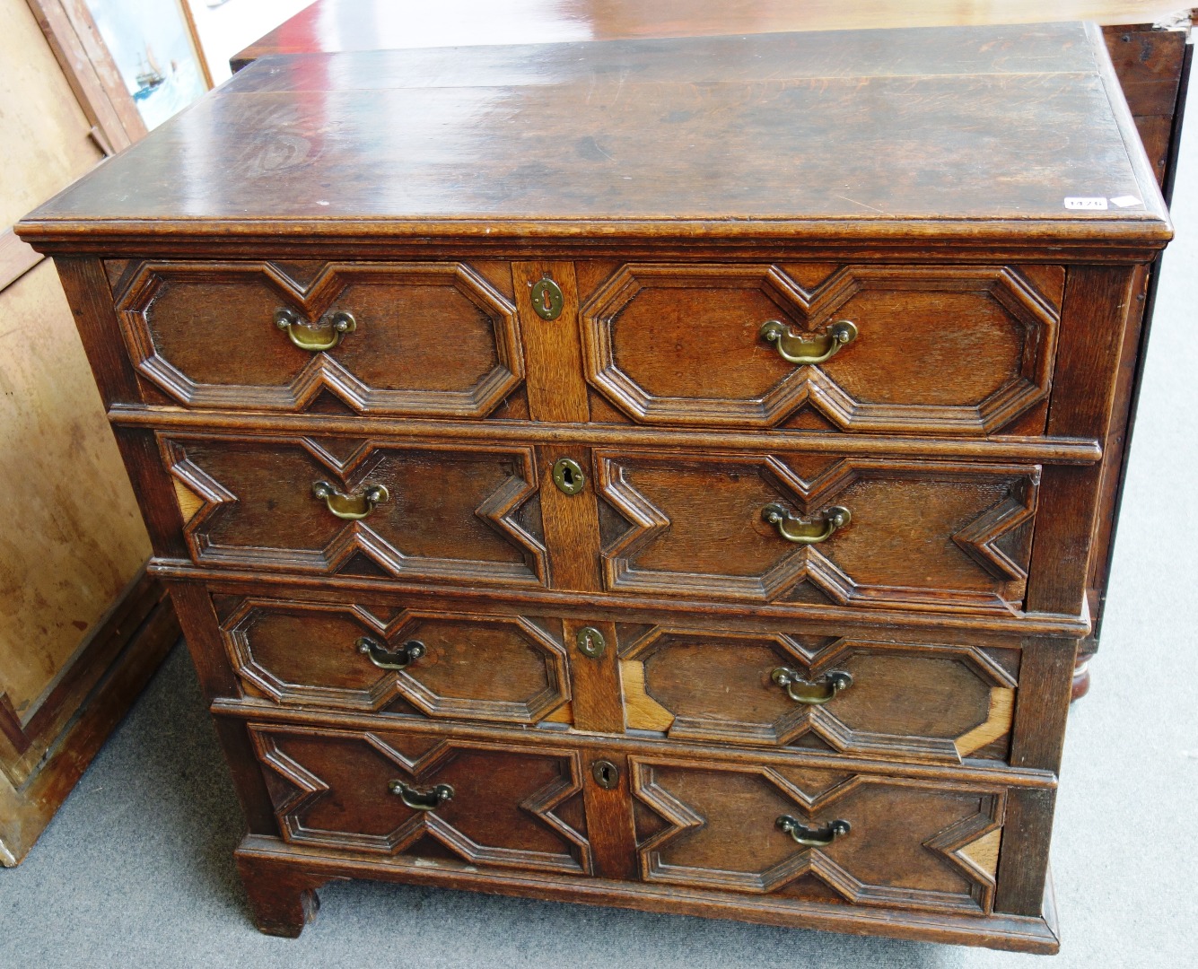 Appraisal: A th century oak chest of four long geometric moulded