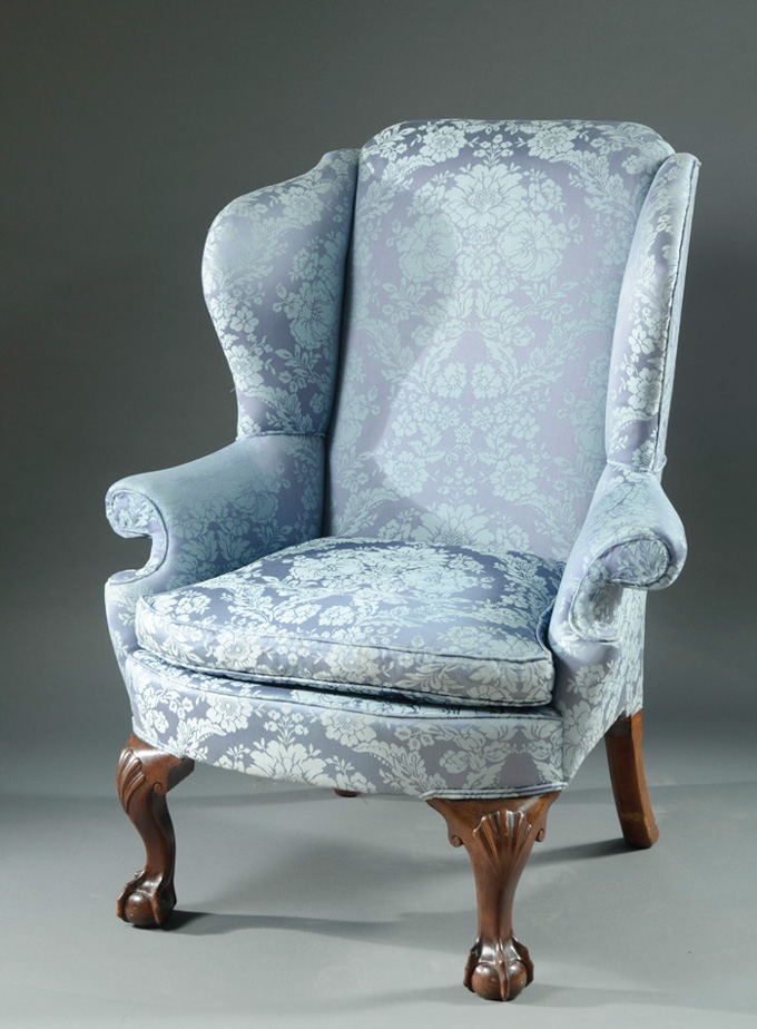 Appraisal: CHIPPENDALE WINGBACK ARMCHAIR late th century elements having blue-on-blue floral