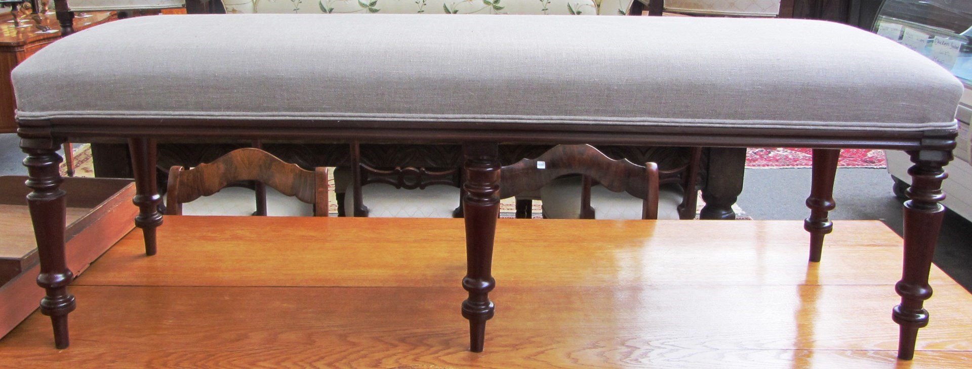 Appraisal: A large rectangular mahogany framed footstool with overstuffed top on