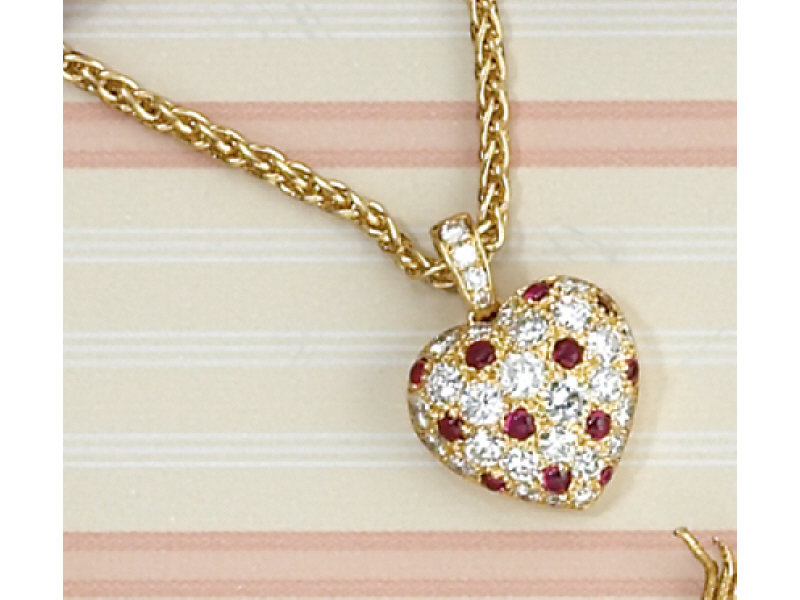 Appraisal: CARTIER DIAMOND AND RUBY HEART PENDANT k yellow gold puffed