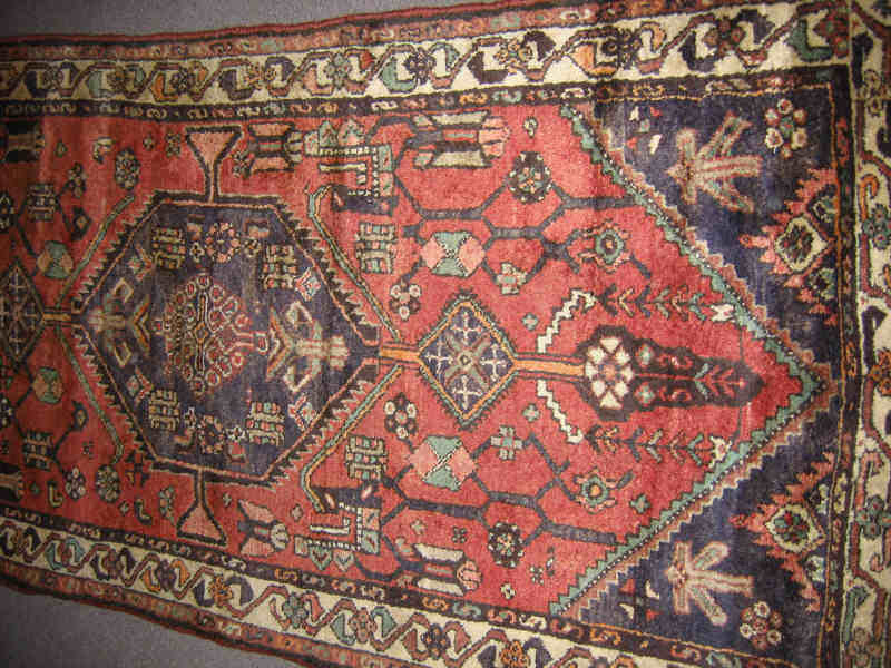 Appraisal: HAMADAN LONG RUG The brick red field of bold angular