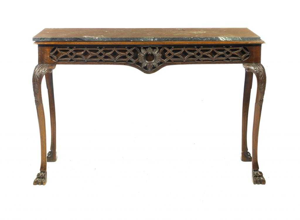 Appraisal: A MAHOGANY SIDE TABLE with rectangular marbled top and carved