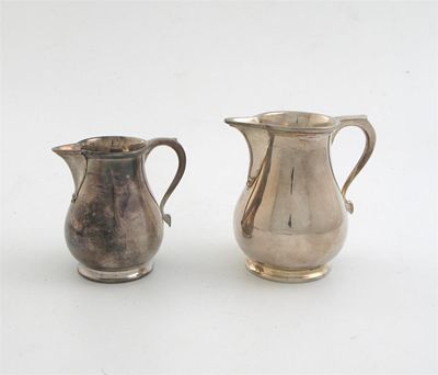 Appraisal: Two modern sparrow beak cream jugs by Walter H Willson