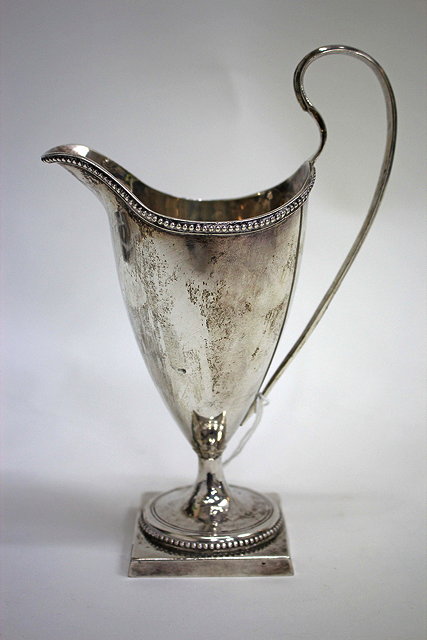 Appraisal: A GEORGE III SILVER HELMET SHAPED CREAM JUG with beaded