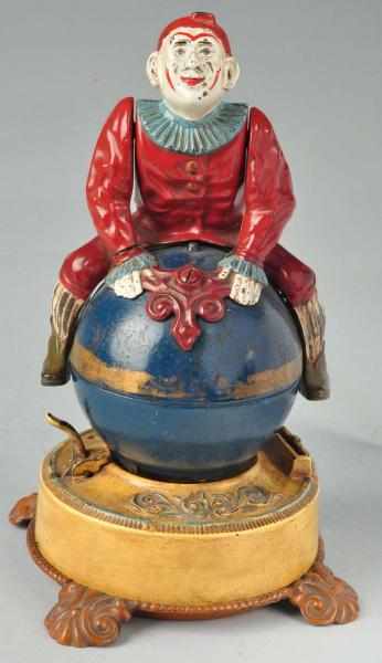 Appraisal: Cast Iron Clown on Globe Mechanical Bank Description Working Manufactured