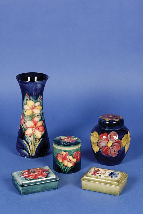 Appraisal: A MOORCROFT BOX AND COVER the shaded blue ground decorated