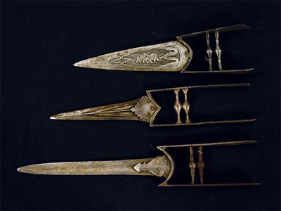 Appraisal: A katar the blade decorated elephants and a horseman in