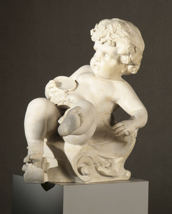 Appraisal: Continental Rococo Style Composition Figure of a Recumbent Putto th